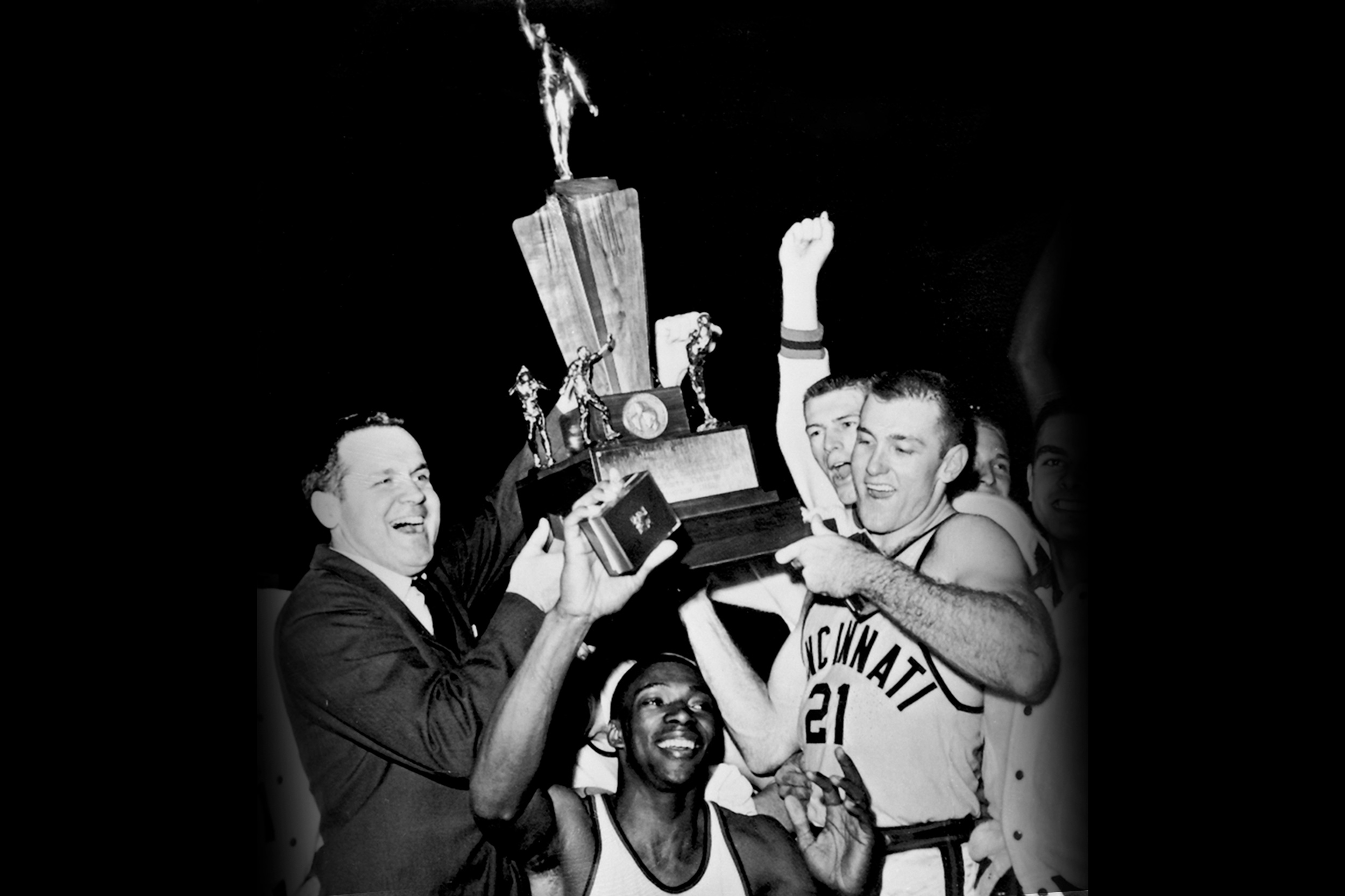 The 1961 Bearcats hoist the National Championship Trophy